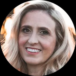 A woman smiling after learning how to lower cholesterol without medication